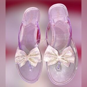 NWT, “Rouge Helium”, iridescent bow jelly sandals sz 10